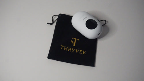 Rechargeable portable massager by Thryvee with carry bag